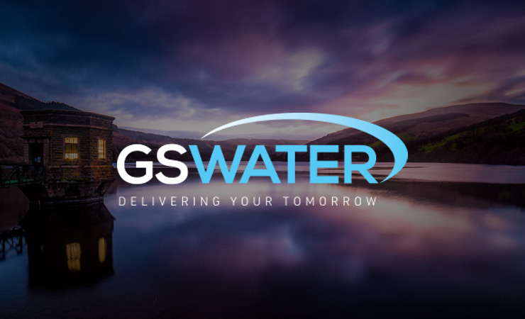 GS Water logo over a reservoir at dusk