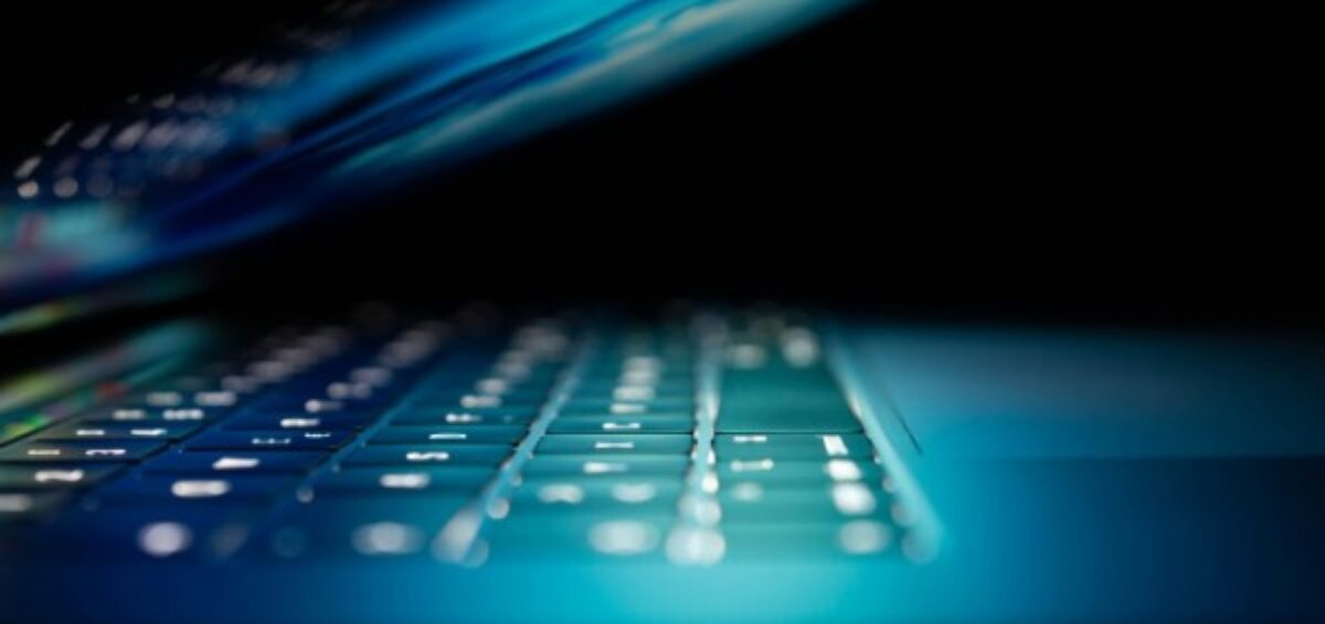 closeup photo of turned-on blue and white laptop computer